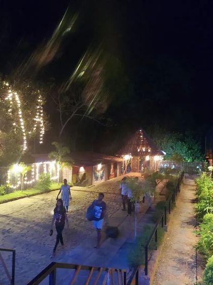 The lively atmosphere at our beachside stay in Gokarna, with cottages lit up at night.