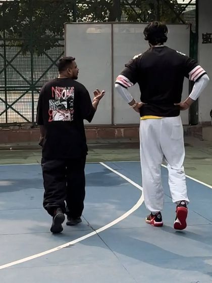 A walk and talk on the court. Mentorship is a huge part of what I do. I'm not just a coach, I'm a big brother.