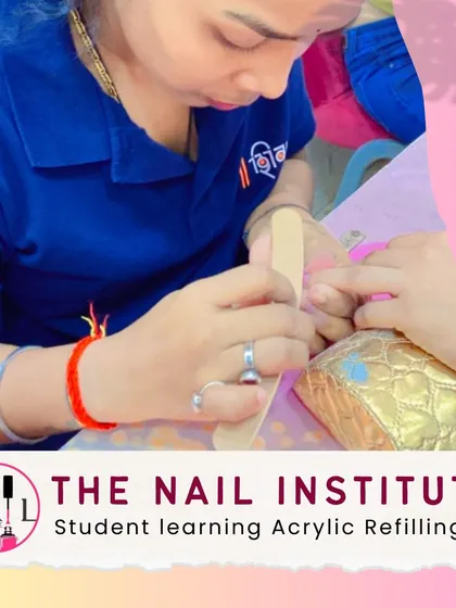 An important part of maintenance is refilling. Here, a student learns how to properly perform an acrylic refill service.