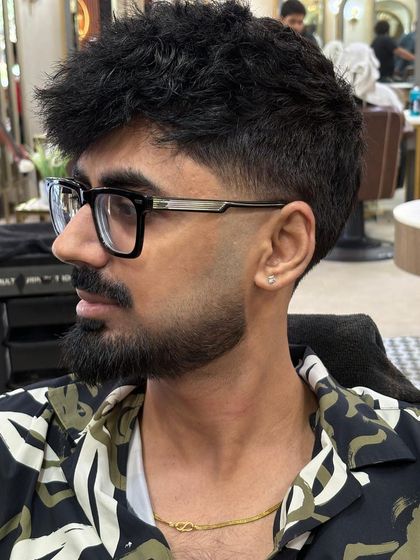 A close-up of a perfectly sculpted Italian beard. I focus on creating clean lines and a shape that complements the client's face and haircut.