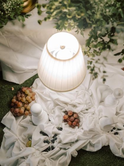 An overhead view of the textured drapes and table lamps, showing the beautiful interplay of light and shadow.