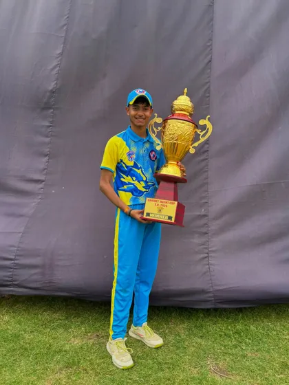 Another member of the winning team with the trophy.