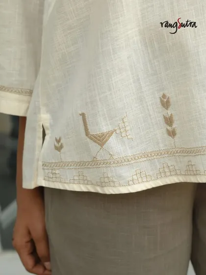 This detail shot from our Bagh collection shows a bird motif embroidered at the hem of a kurta. The harmony of nature's beauty, captured in every stitch, is what makes this collection special.