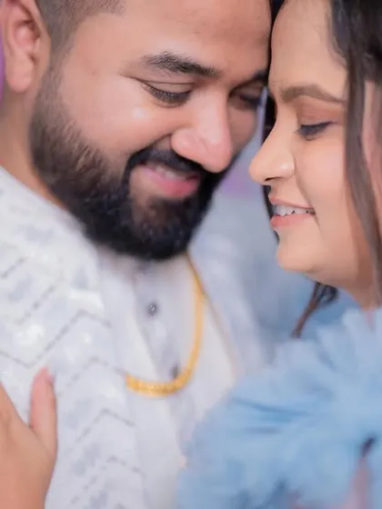 Another romantic shot of the couple. The bride's makeup is soft and glowing, perfect for her fairy-tale blue engagement gown.