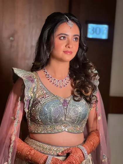Another angle of this beautiful look, showcasing the intricate details of her outfit.