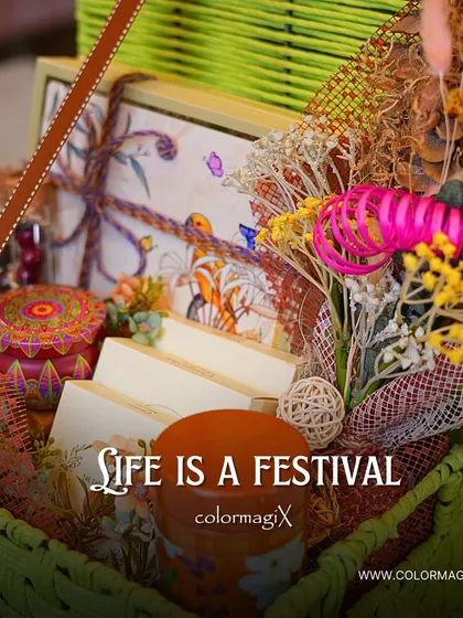 Life is a festival. A close-up of our green jute hamper, highlighting the intricate details and the vibrant mix of items inside, from jars to decorative boxes.