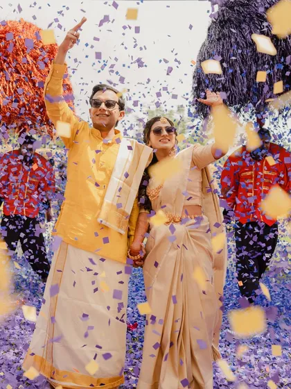 The pure, unscripted joy of a Haldi celebration. We believe in creating moments of genuine connection and fun, where couples are surrounded by the vibrant energy of their loved ones. This confetti-filled entry captures that spirit perfectly.