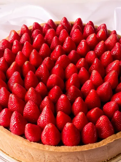 When passion meets persistence, magic happens. This 11 kg Signature Chocolate Pudding Tart with fresh strawberries became the centerpiece of a client's engagement celebration.