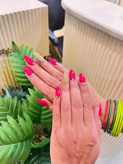 This look is perfect for a party or wedding. The hot pink and gold glitter combination is fun and glamorous, with rhinestones adding a final touch of elegance.