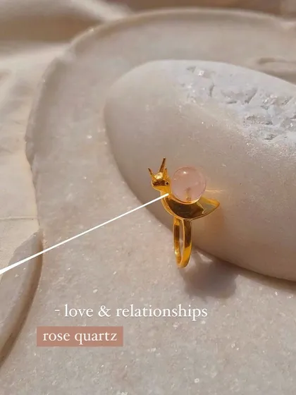 A closer look at the rose quartz 'snáil' ring, a charm for love and relationships.
