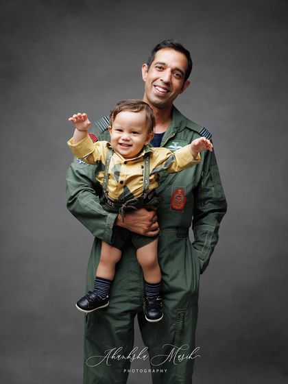 A duplicate of the joyful father and son portrait, this image is filled with the boundless energy and happiness of childhood.