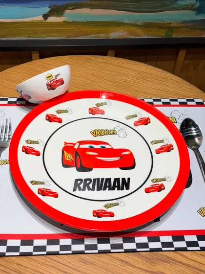 Vroom vroom. Make mealtime the best time with our personalised kids' crockery sets. Featuring fun themes like 'Cars', each set includes a name-printed plate, bowl, and placemat to make eating an adventure.
