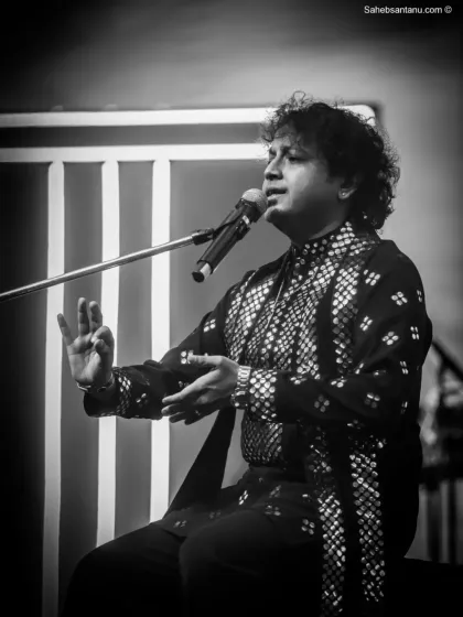 A quiet, soulful moment captured in black and white. Even in a high-energy corporate show, we find moments of deep musical connection.