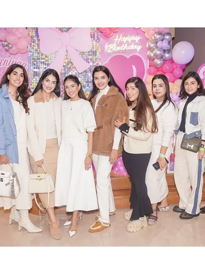 A group of stylishly dressed guests posing at a Barbie-themed party. Our venue is the perfect backdrop for fashionable and memorable social gatherings.