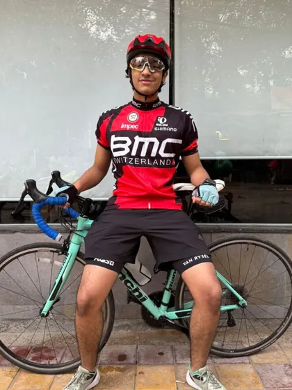 The young new member posing with his Bianchi bike. He's already got the style and the confidence of a pro.