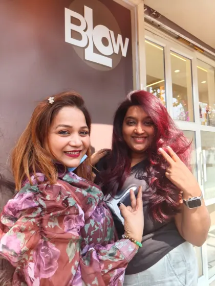 Posing with a client outside the salon. Her new red hair looks fantastic, and her smile says it all.