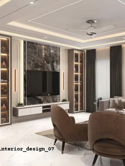A full-view of a living room where the TV unit is the centerpiece. Flanked by two illuminated glass display cabinets, the dark marble backdrop and white console create a bold, symmetrical design.