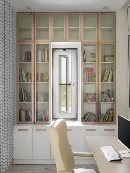 A productive home office needs to be both ergonomic and inspiring. For the Lakshya project, we designed this study with ample storage, including glass-fronted bookshelves built around a window to maximize natural light. The sleek, modern furnishings create a workspace that is comfortable and stylish.