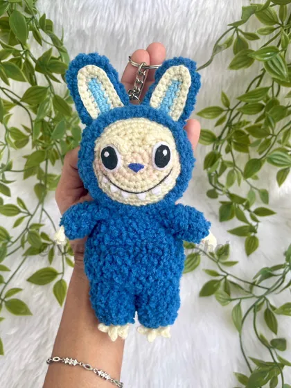 I love keeping up with what's new and fun, and I was so excited to create my own version of the popular Labubu monster. This little guy is made with a soft, fluffy yarn and works perfectly as a quirky keychain or a charm for your bag.