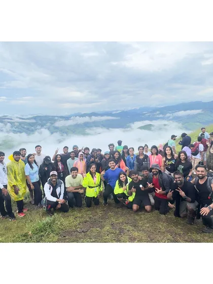 A large group photo from our Gangadikal trek, with the beautiful misty valley in the background.