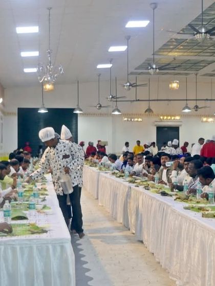 Guests seated and ready for the meal service to begin. The uniformity of the setup creates a visually appealing and organized dining experience.
