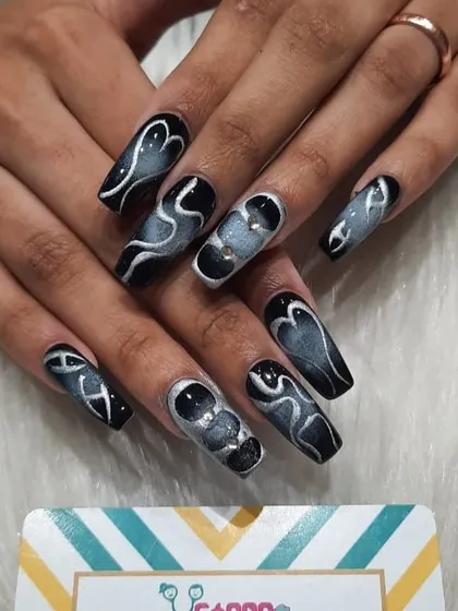 For a bold and edgy look, I created this smoky effect on long, square-shaped acrylic extensions. The design uses shades of black, grey, and silver chrome to create a sense of movement and depth.