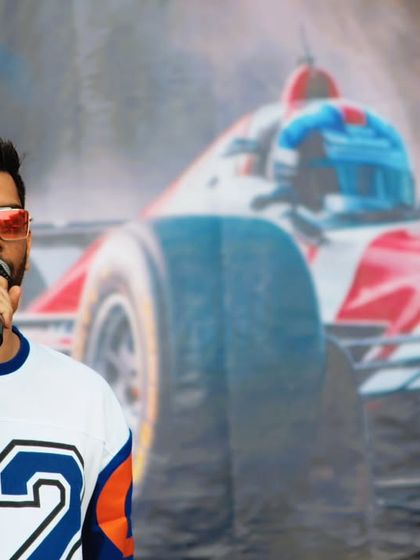 Hosting in front of a backdrop that screams speed and adrenaline. The theme of the event always influences my energy and delivery.