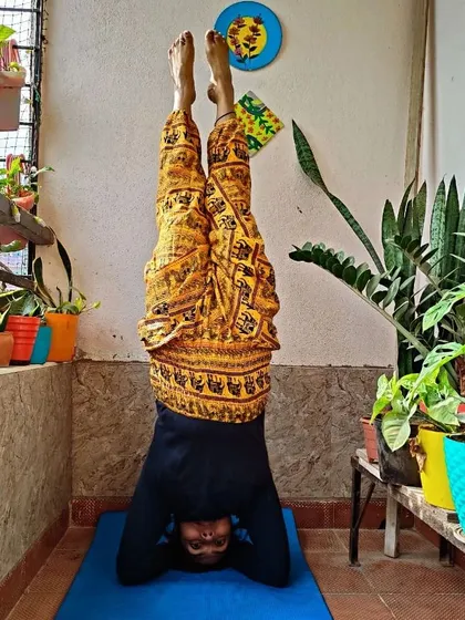 Sometimes you need a different angle to look at the world. Here I am in Sirsasana, or headstand, an inversion that improves circulation, calms the nervous system, and builds upper body strength.