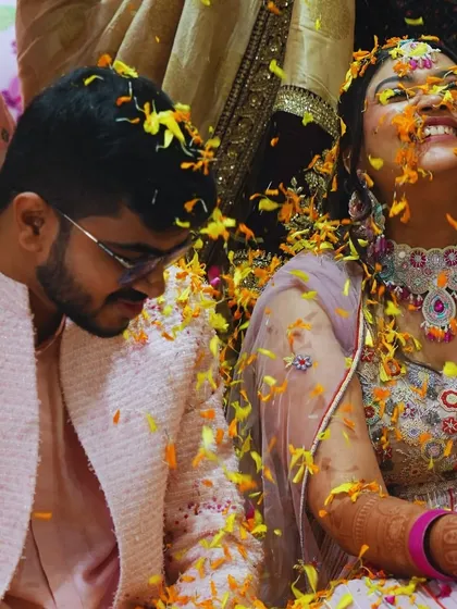 A moment of pure, unscripted joy during a 'Phoolon ki Haldi'. We believe the best memories are made when you're surrounded by love, laughter, and a shower of flower petals.
