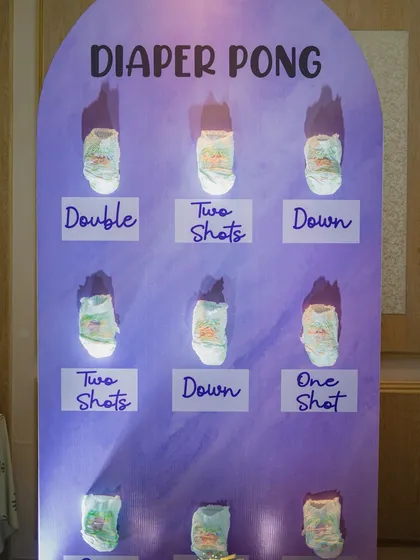 Who says baby showers can't have a little friendly competition? This 'Diaper Pong' game station is always a huge hit, bringing so much laughter and energy to the party. I handle the entire setup for you.