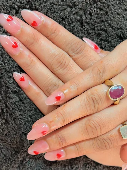 A sweet and simple design with a sheer base and tiny red hearts.