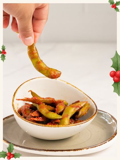Spicy edamame pods are a great healthy and festive snack for your Christmas party.