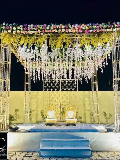 A wider shot of the stunning floral and crystal mandap, showcasing its grand structure and the beautiful play of light. This is how I make Jaimala moments truly magical.