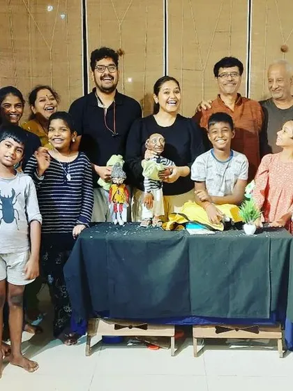 A group photo with all the happy participants after a successful puppet workshop at Tasmai Art Gallery.