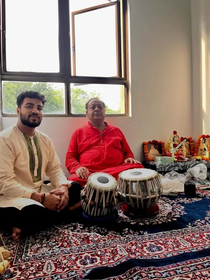 This is a moment of receiving blessings from my father and guru, Shri Naveen Kumar. The Guru-Shishya Parampara, or the teacher-disciple tradition, is the foundation of my music and my teaching.