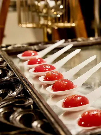 These are my rose flavoured molecular dessert drops. Served on elegant spoons, these spheres burst in your mouth with a fragrant rose flavour, offering a unique and memorable gastronomic experience.