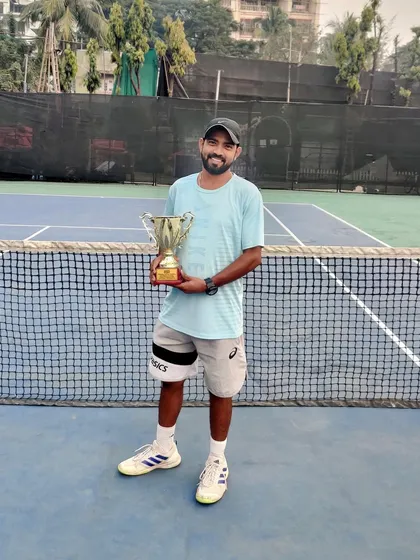 Coach Subhash with his winner's trophy. We believe that coaches who are active in the game bring the most current and effective strategies to their lessons.