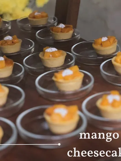 A tray of my mini mango cheesecakes. These individual desserts are perfect for parties, allowing guests to enjoy a taste of creamy, fruity goodness without the need for slicing.