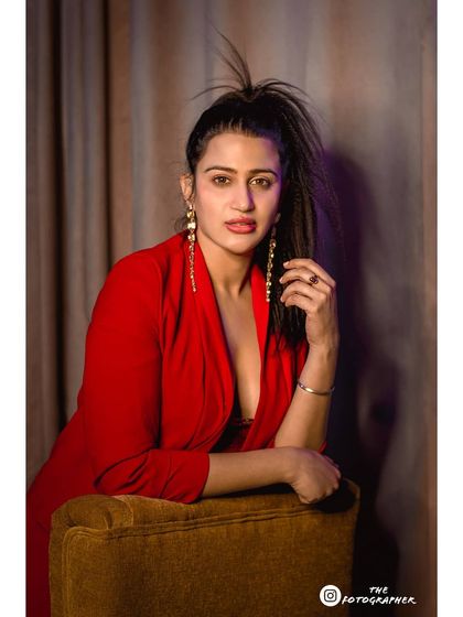 A final portrait from the red blazer set, demonstrating a different mood and composition. This variety is key for a professional lookbook.