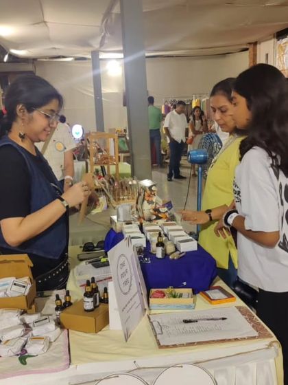 Interacting with customers at my stall. I believe in creating a welcoming space where people can learn about natural skincare without any pressure.