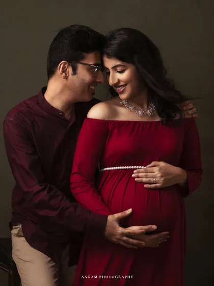 A tender moment shared between partners. These are the memories that become the foundation of your family's story, captured with warmth and authenticity.