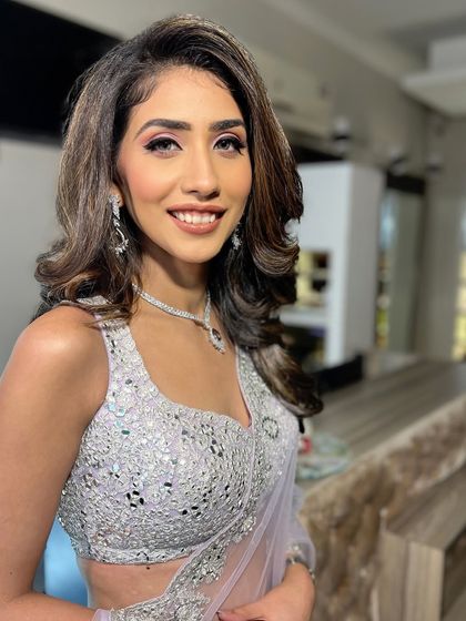 A happy and confident portrait, her Roka makeup looking absolutely perfect.