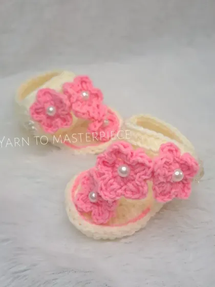 A full view of the pink floral summer sandals, showing their delicate and open design that's perfect for keeping little feet cool.