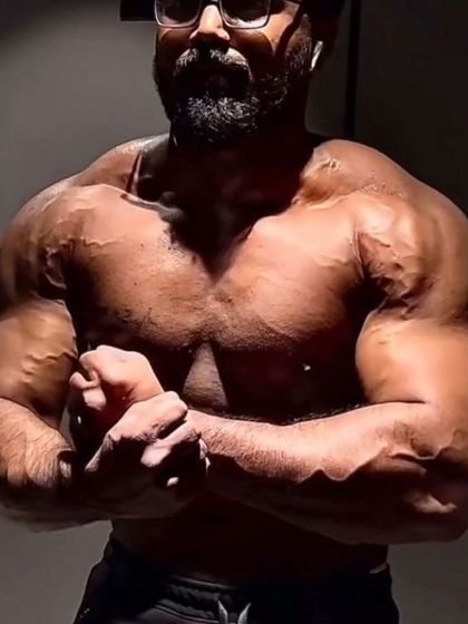 The "after" shot of the growth phase. The vascularity and sheer size of the muscles show the effectiveness of the bulking protocol.