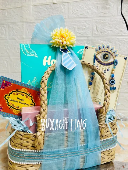 Another angle of the blue-themed Rakhi hamper, showing the arrangement of all the special gifts inside.