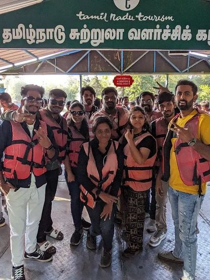 The group posing at the Tamil Nadu Tourism boat house before their ride on Kodai Lake.