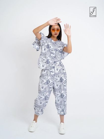 A playful pose that adds energy and fun to the lookbook.