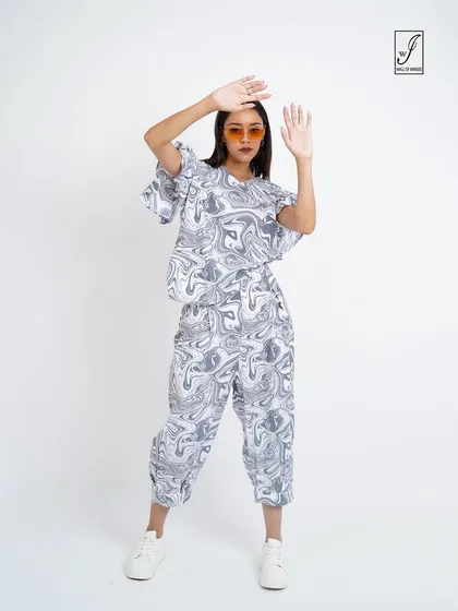 A playful pose that adds energy and fun to the lookbook.