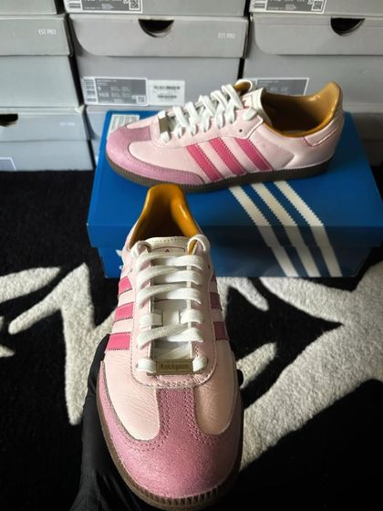 A front view of the pink bubblegum custom Sambas.