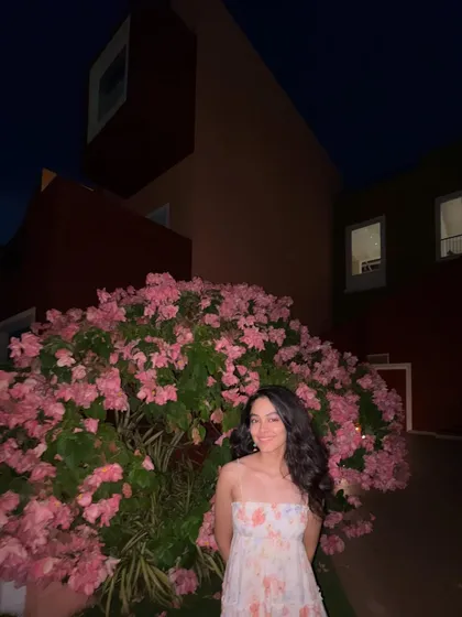 Standing in front of a beautiful bougainvillea bush at night. The vibrant colors and the quiet of the evening create a really romantic mood.
